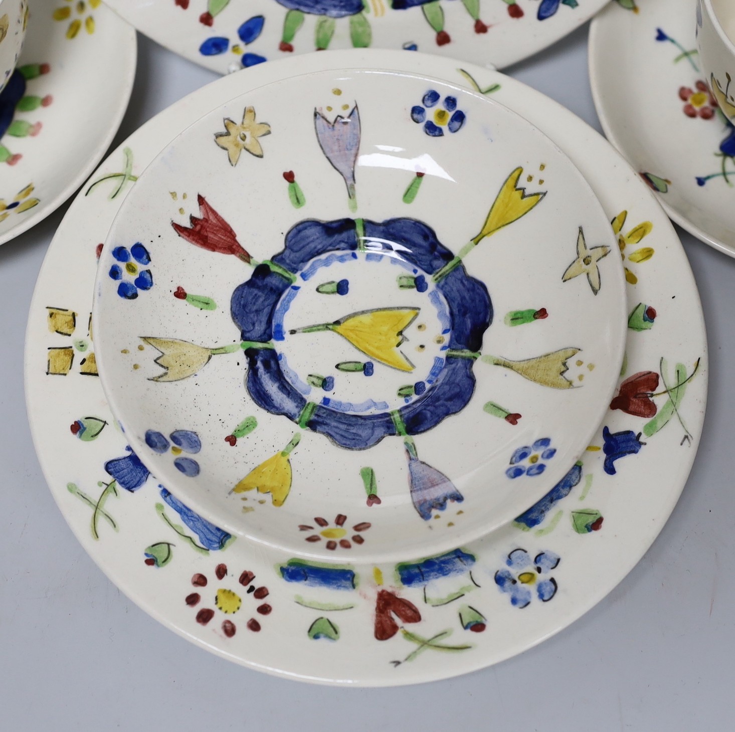 Jessie Marion King (1875-1949). Three different floral design tea cups, saucers and plates